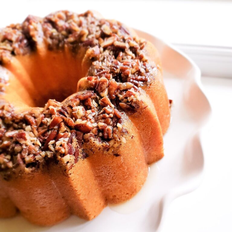 Butter rum bundt cake topped with pecans